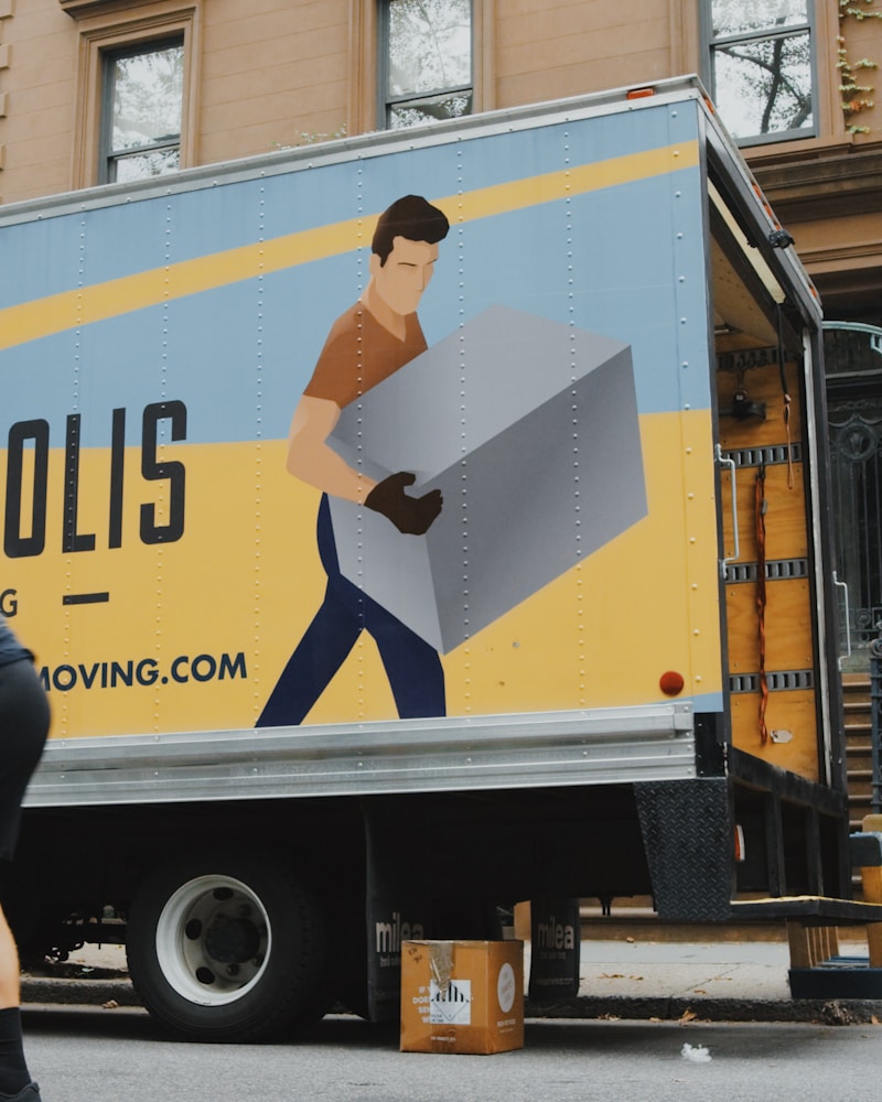 Couple unpacking boxes in new home with dog