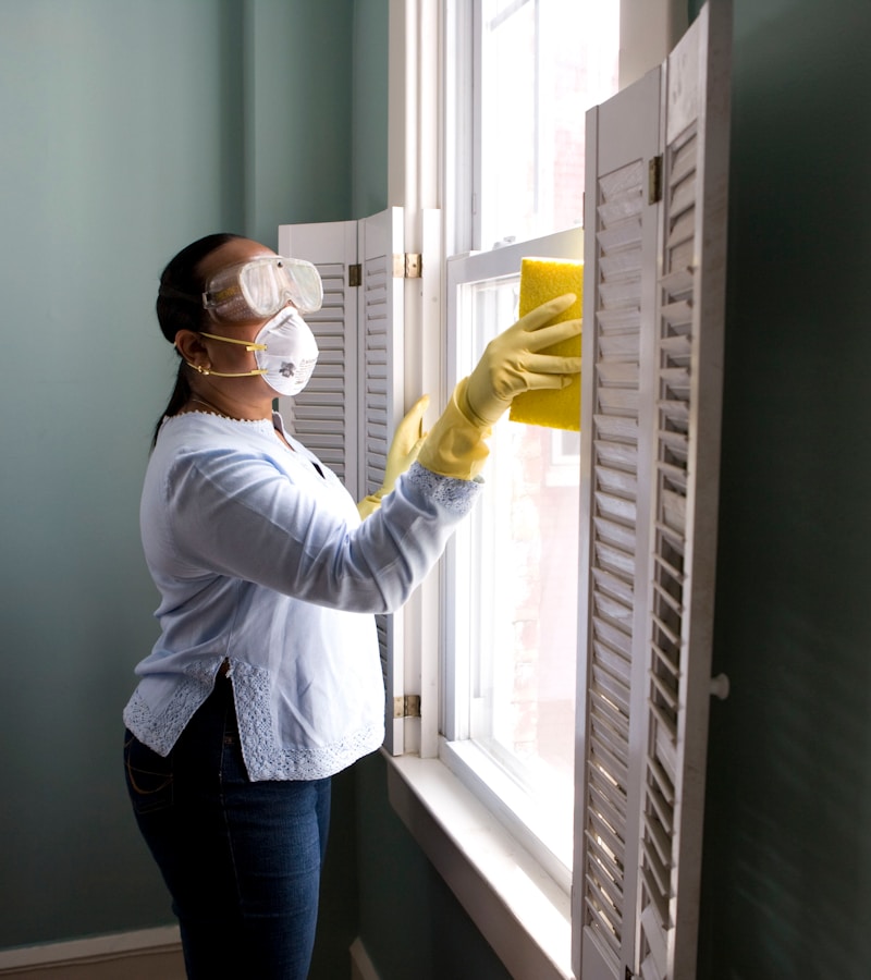 Woman changing light bulb
