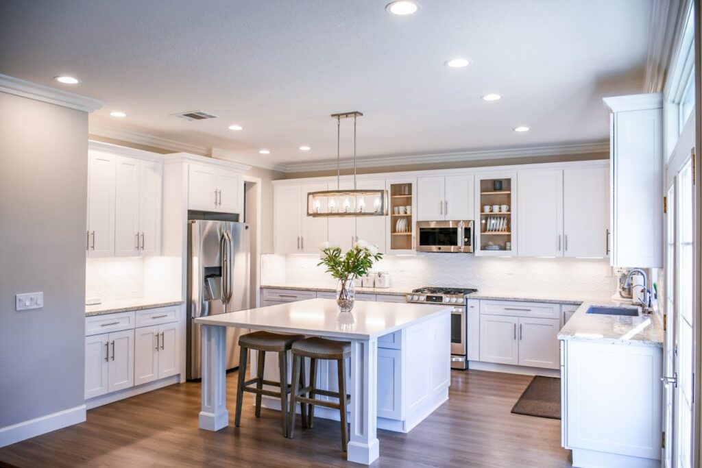 white kitchen with marble island